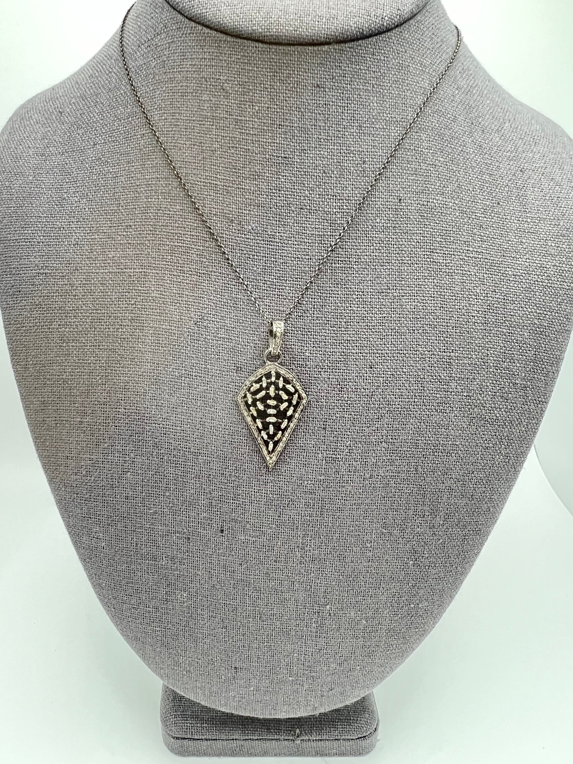 Arrowhead with baguette diamonds, diamond and oxidized sterling silver chain